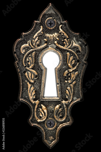 Bright light in the keyhole, decorative design element, isolated on black background