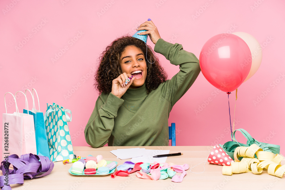 Young african american woman planning a birthday Young african american woman planning a birthday