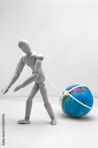 A dummy drags the weight of the world