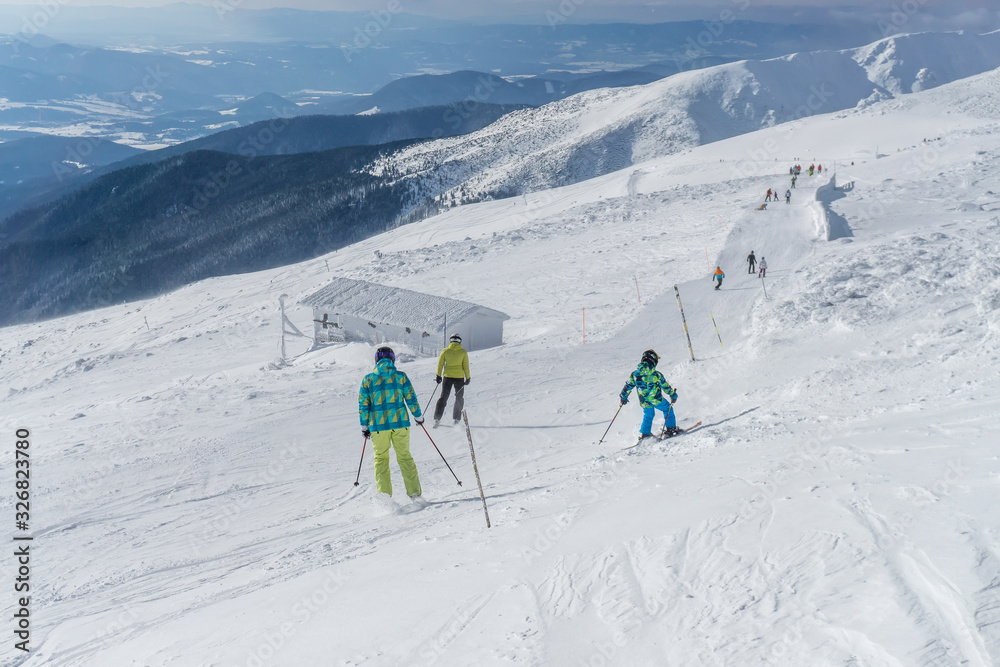 Skiers on a slope in the mountains of Slovakia