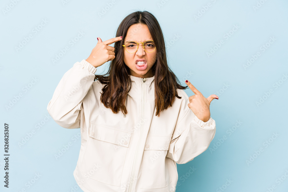 Young mixed race hispanic woman isolated showing a disappointment gesture with forefinger. Young mixed race hispanic woman isolated showing a disappointment gesture with forefinger.
