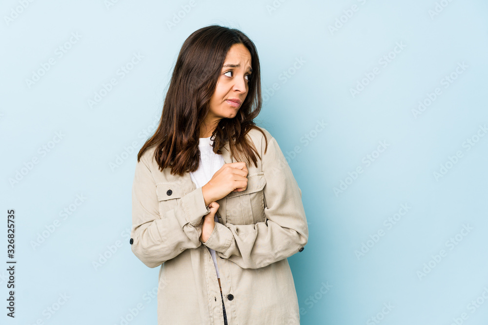 Young mixed race hispanic woman isolated confused, feels doubtful and unsure. Young mixed race hispanic woman isolated confused, feels doubtful and unsure.