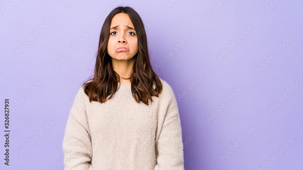Young mixed race hispanic woman isolated blows cheeks, has tired expression. Facial expression concept. Young mixed race hispanic woman isolated blows cheeks, has tired expression. Facial expression concept.
