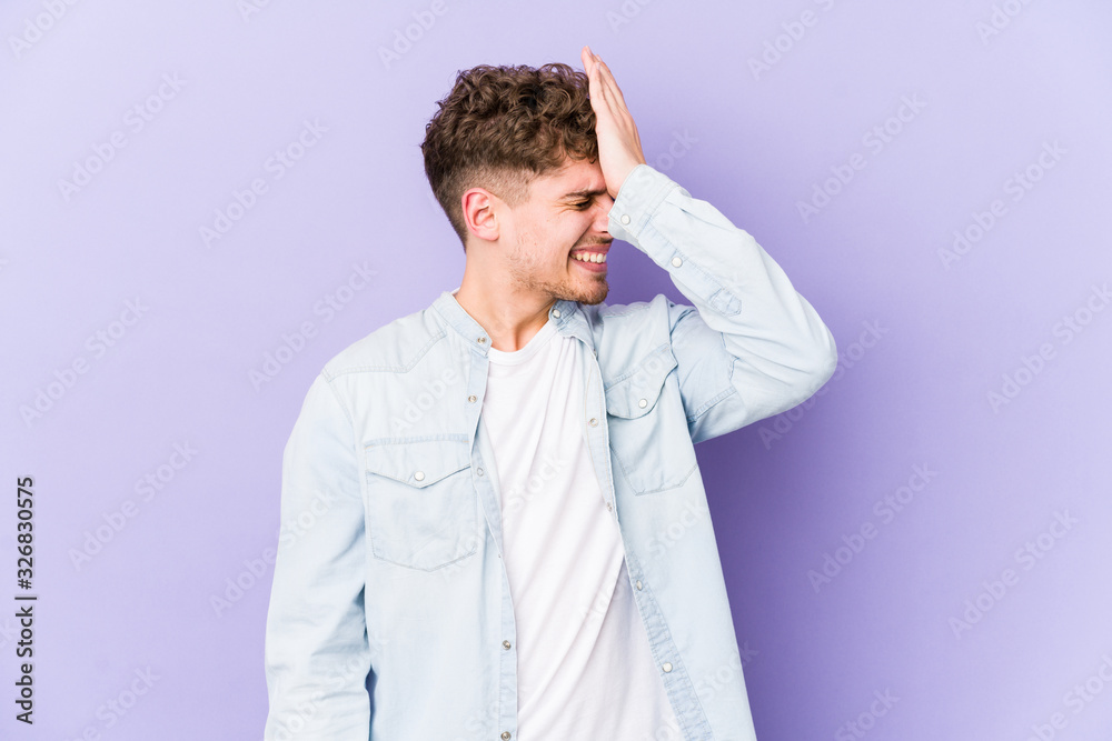 Young blond curly hair caucasian man isolated forgetting something, slapping forehead with palm and closing eyes. Young blond curly hair caucasian man isolated forgetting something, slapping forehead with palm and closing eyes.