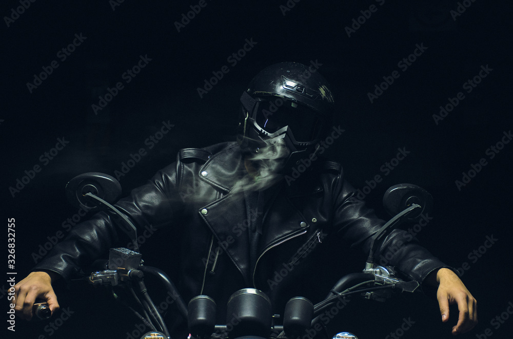  motorcyclist with smoke in the dark