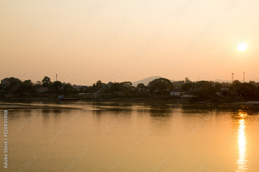 Scenic view of Mekong river against sunset sky