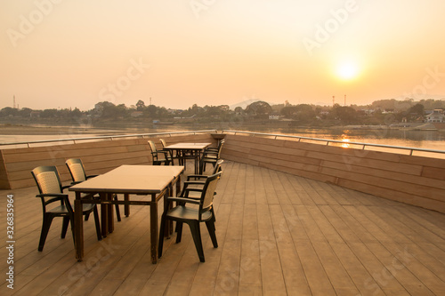 Dinner table on the boat against sunset sky © pong