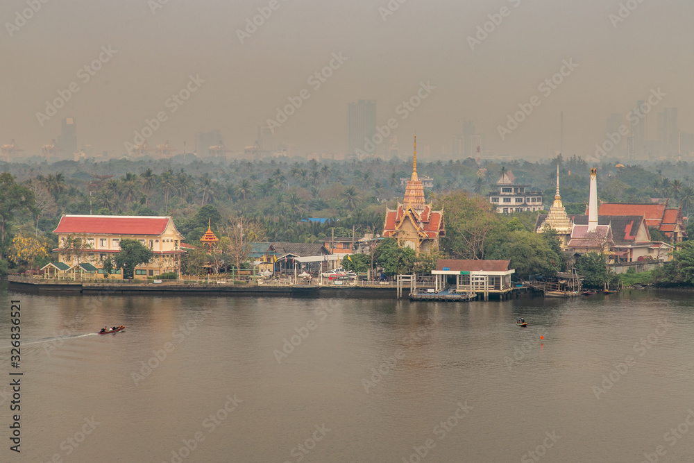 The view of the Chao Phraya River that sees the green area next to the river, Which is called Bang Krachao.
