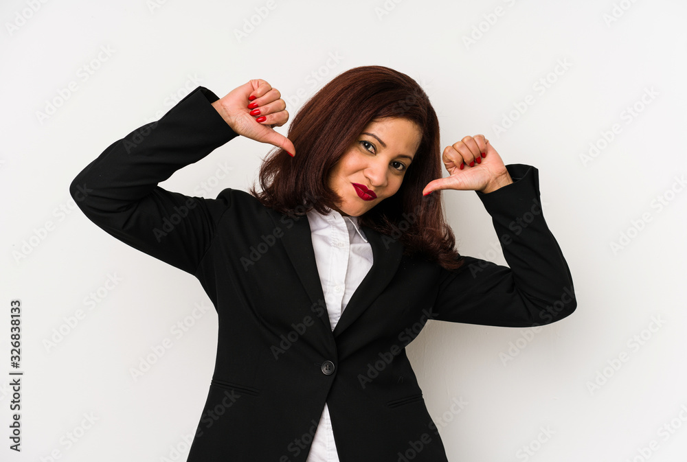 Middle age latin business woman isolated feels proud and self confident, example to follow. Middle age latin business woman isolated feels proud and self confident, example to follow.