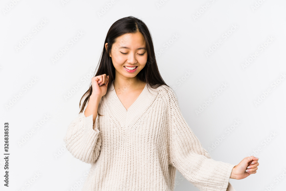 Young chinese woman isolated dancing and having fun. Young chinese woman isolated dancing and having fun.