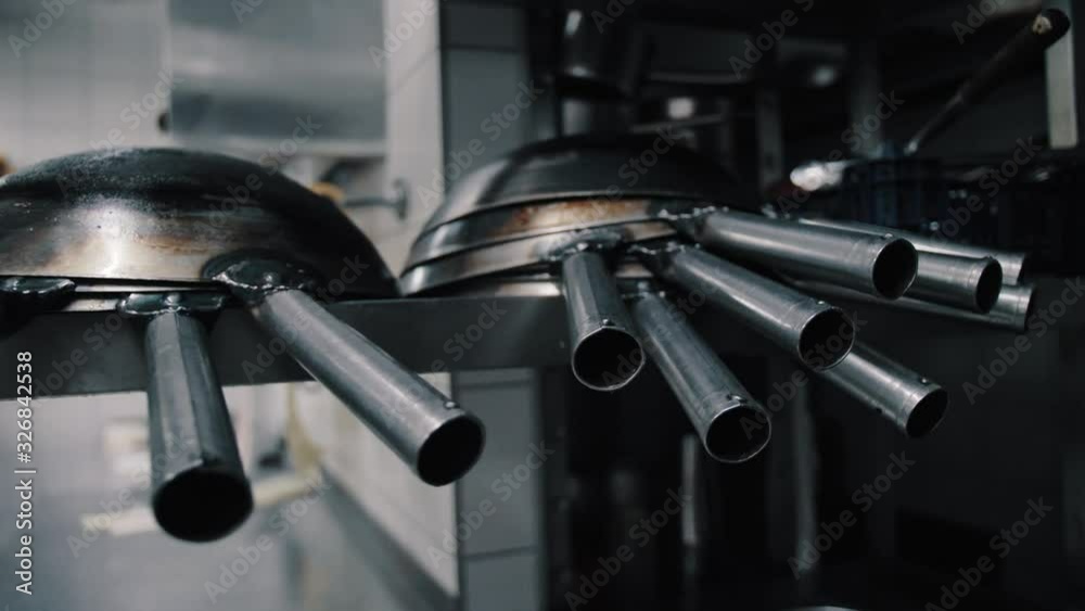 wok pans on the shelf