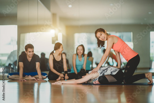 Group of Healthy people are happiness for exercising with yoga in the fitness room..