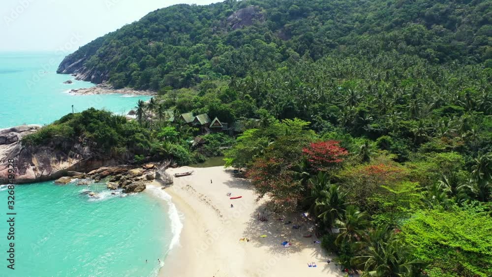 Aerial panorama of the east coast of Koh Phangan island, Thailand. Sandy beach jungle and peaceful turquoise lagoon Aerial panorama of the east coast of Koh Phangan island, Thailand. Sandy beach jungle and peaceful turquoise lagoon