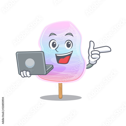 Cool character of rainbow cotton candy working with laptop