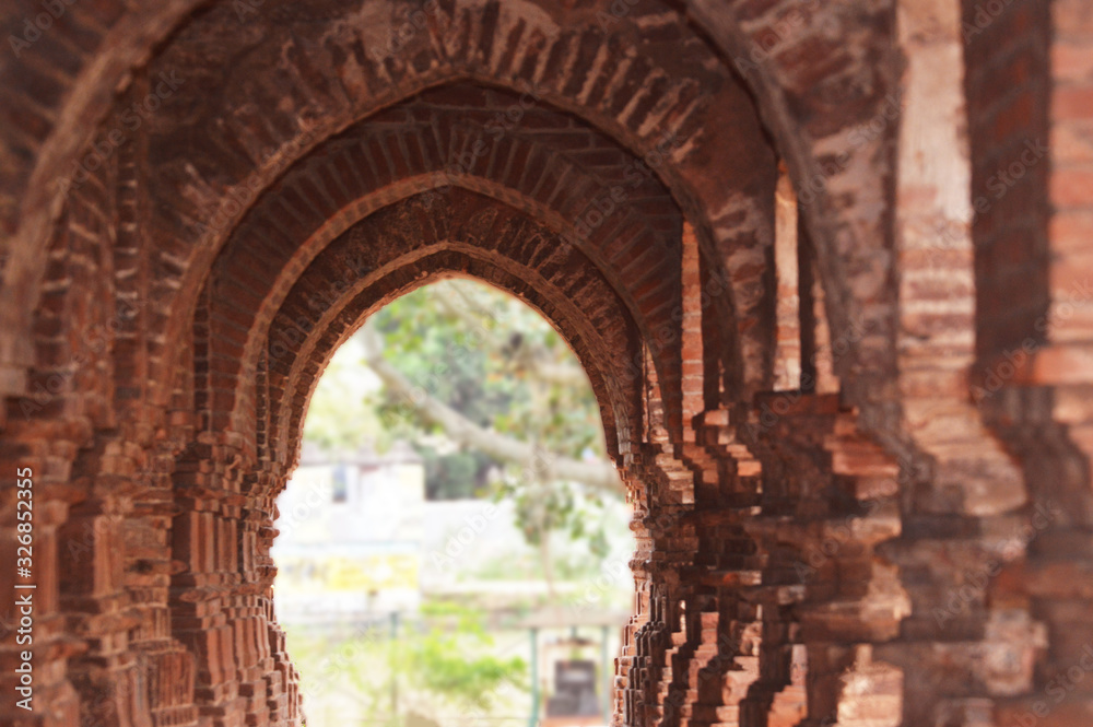 beautiful arches of old temple made up of red bricks