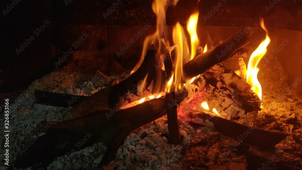 Fireplace with wood burning in the house. Close up shot 4k video