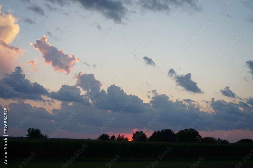 Fototapeta premium clouds and field