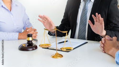 Judge gavel deciding on agreement prepared marriage divorce and Angry couple arguing telling their problems settlement, legal separation concept.