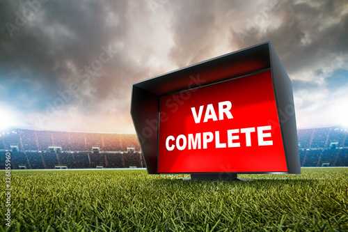 technology var decision complete.The video assistant referee scene a match official in football stadium.  photo