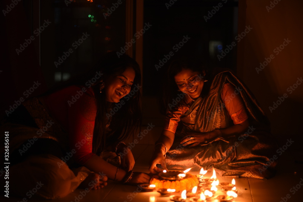 Two beautiful Indian Bengali women in Indian traditional dress are