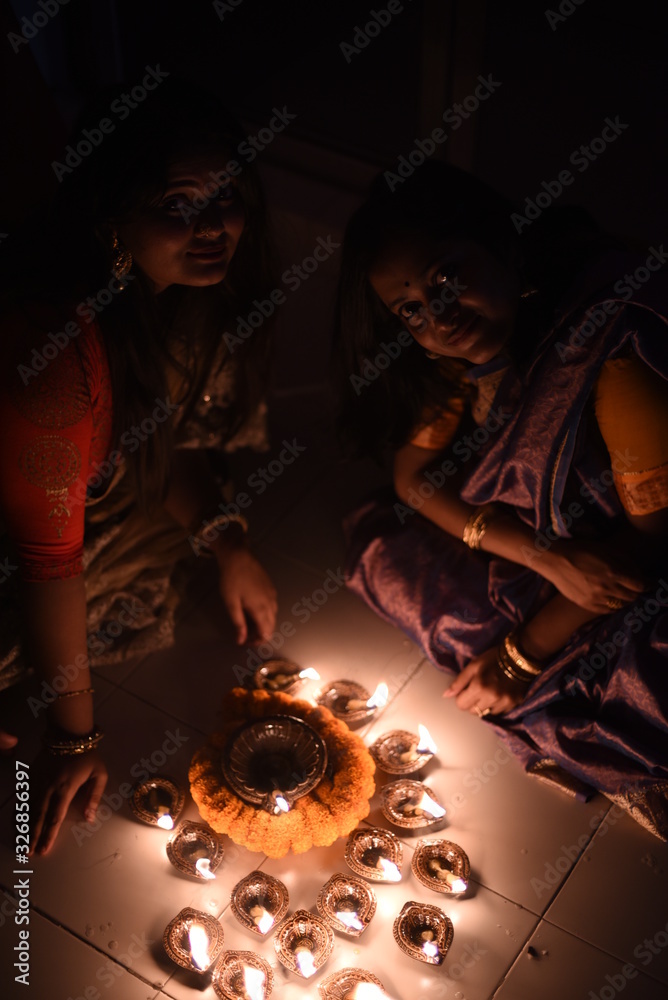 Two beautiful Indian Bengali women in Indian traditional dress are