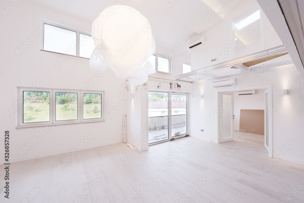 Interior of empty stylish modern open space two level apartment