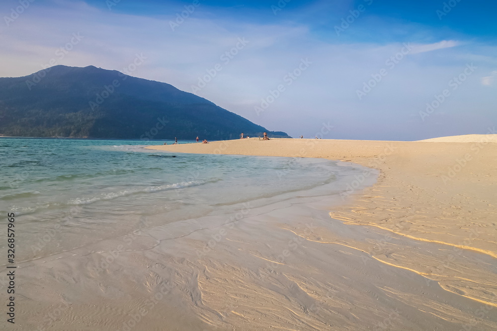 view seaside on white sand beach with blue-green sea and adang island with cloudy sky background, sunset beach, Lipe island, Satun, southern Thailand. view seaside on white sand beach with blue-green sea and adang island with cloudy sky background, sunset beach, Lipe island, Satun, southern Thailand.