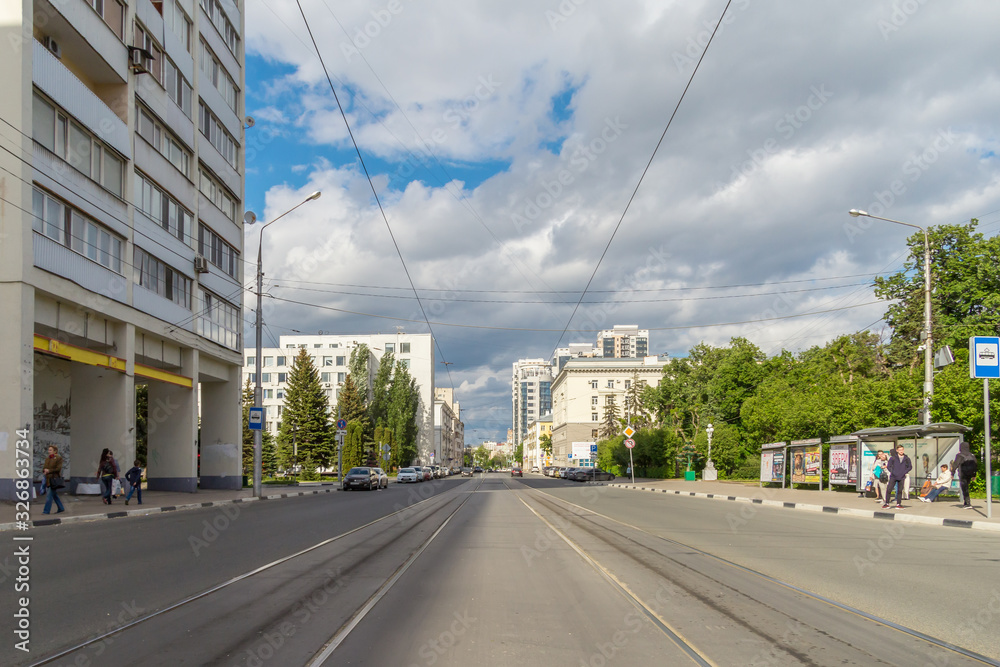 Street with tram tracks on a sunny day in Samara