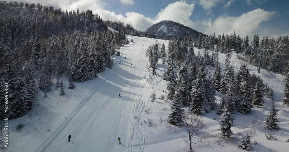 Beautiful aerial shot of skiers and ski lift in Bakuriani ski resort. 2023 years freestyle fis championship destination. Kokhta-Mitarbi Piste Beautiful aerial shot of skiers and ski lift in Bakuriani ski resort. 2023 years freestyle fis championship destination. Kokhta-Mitarbi Piste