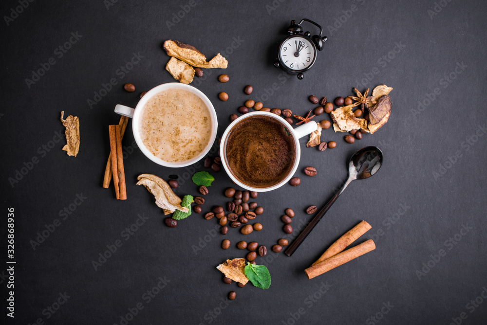 Fragrant coffee of different kinds and varieties, with dried mushrooms and mint leaf on a black background. Fragrant coffee of different kinds and varieties, with dried mushrooms and mint leaf on a black background.