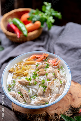 Rice noodle soup with many delicious ingredients photo