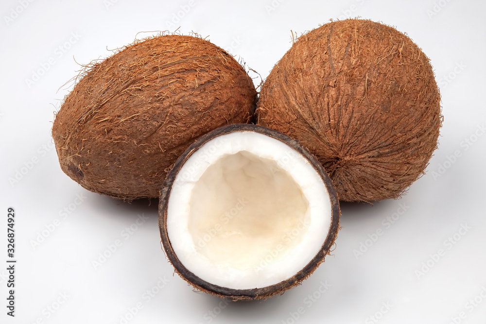 cut fresh coconut on a white background. vitamin fruits. healthy food cut fresh coconut on a white background. vitamin fruits. healthy food