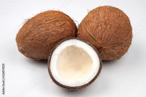 cut fresh coconut on a white background. vitamin fruits. healthy food