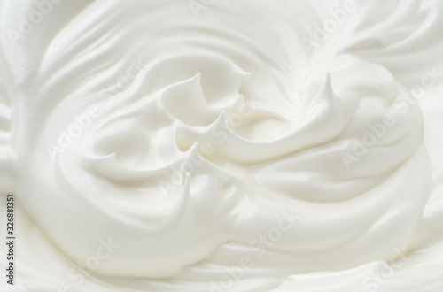 Waves of white eggs cream  dairy yogurt close-up.