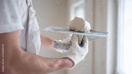 Quadro su tela construction worker plastering on gypsum walls