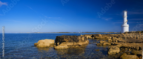 White lighthouse in La Savina, Formentera island, Spain