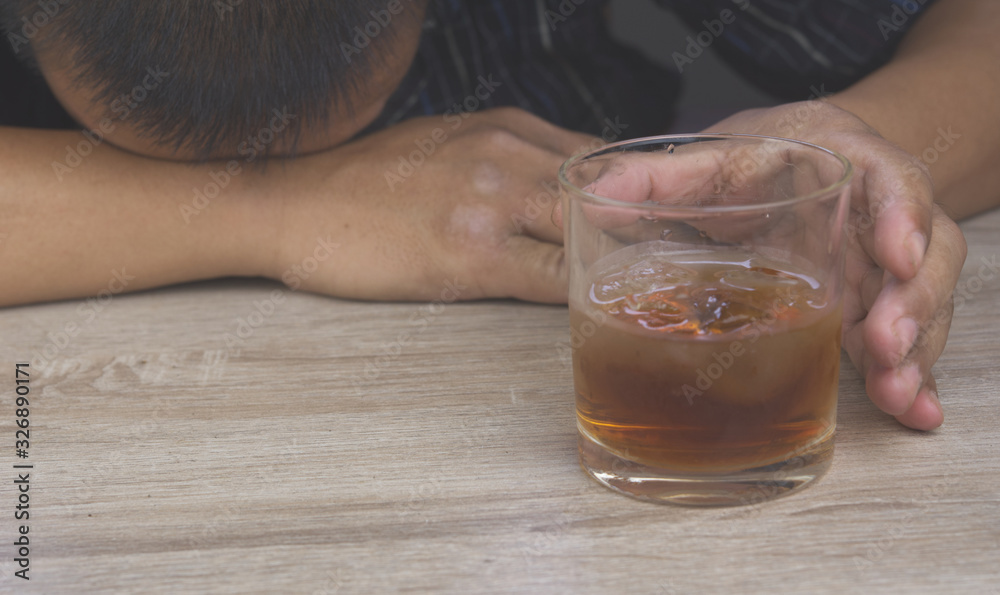Alcohol or Alcoholic diseases concept.Man with glass of whiskey. Alcohol or Alcoholic diseases concept.Man with glass of whiskey.