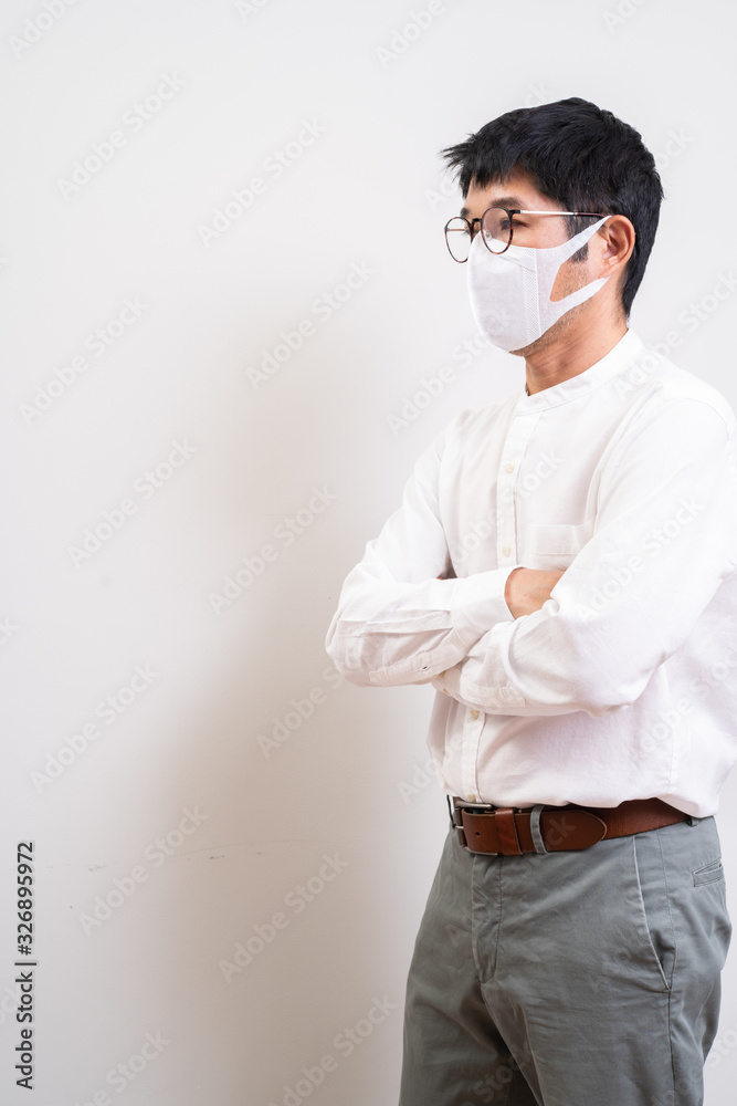 Asian businessman wearing surgical mask to prevent flu disease Coronavirus Asian businessman wearing surgical mask to prevent flu disease Coronavirus