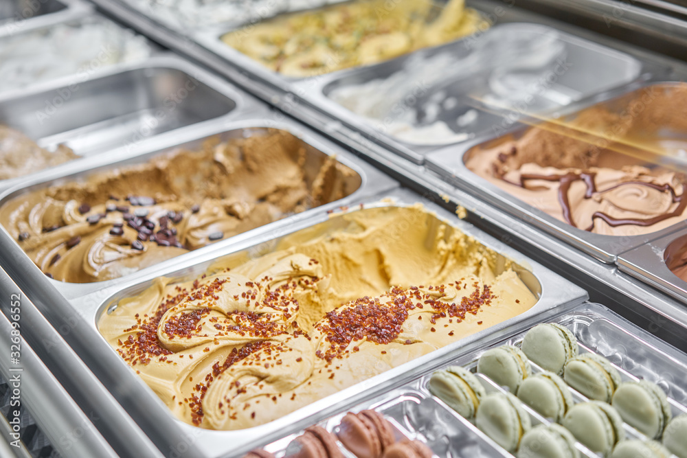 Caramel Gelato. Flavors various ice cream in Rome, Italy. Italian gelateria. Assortment of colorful gelato on cafe showcase. Natural fresh ice cream.