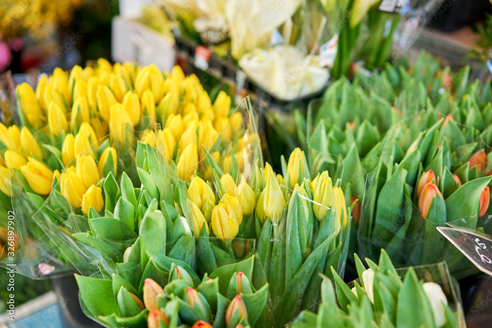Bunches of different colorful flowers in buckets on street flower market in Anemone, poppy Bunches of different colorful flowers in buckets on street flower market in Anemone, poppy