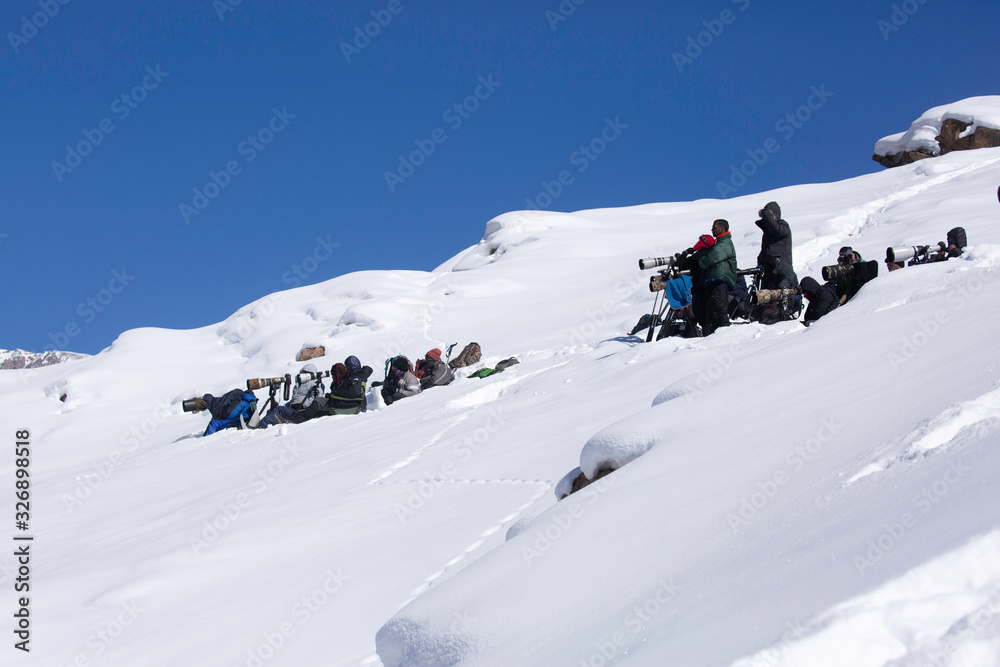 The photographers at the snow covered Kibber mountains waiting to capture the glimpse of Snow leopard at Spiti Valley, India on February 14, 2020