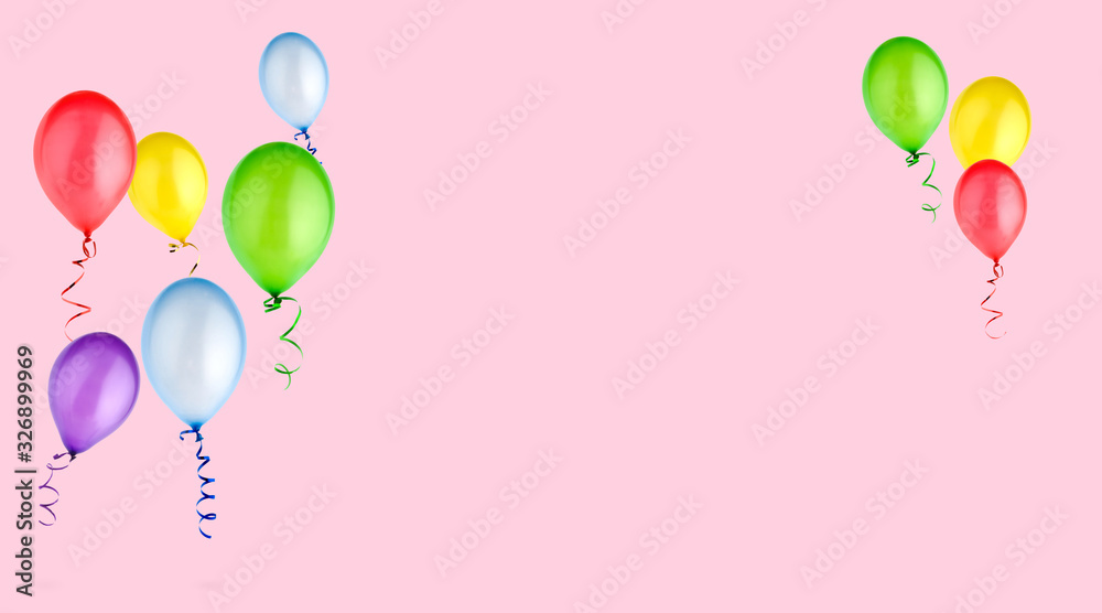 colorful balloons on pink background