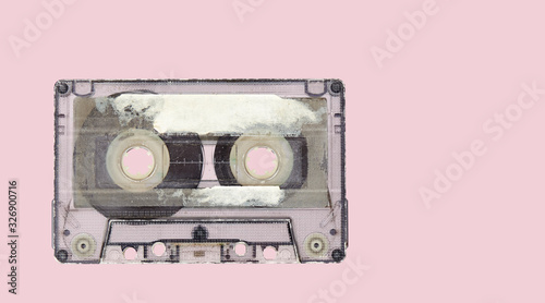 Retro audio tape cassette on a pink background. Top view