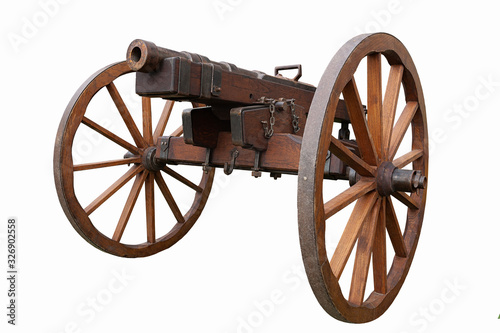 Fototapeta Old vintage gunpowder cannon on wooden carriage with large wheels isolated on wh