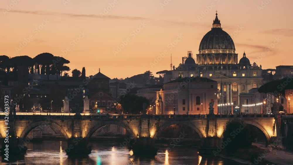 Vatican, Italy. Papal Basilica Of St. Peter In The Vatican And Aelian Bridge In Evening Night Illuminations. Day To NIght Time Lapse. Sunset Time Vatican, Italy. Papal Basilica Of St. Peter In The Vatican And Aelian Bridge In Evening Night Illuminations. Day To NIght Time Lapse. Sunset Time