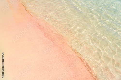 Pink beach with transparent waters in Greece. Elafonissi beach, Crete Greece