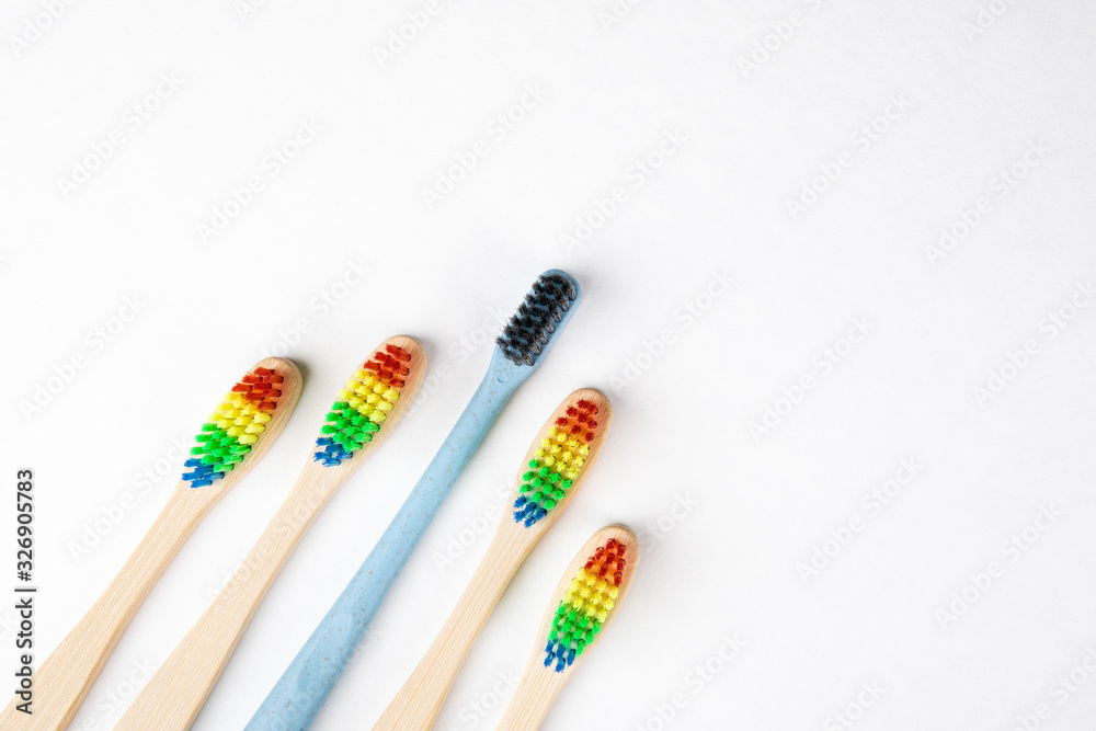 Leadership, difference and personality concept. Toothbrushes, copy space on a white background Leadership, difference and personality concept. Toothbrushes, copy space on a white background