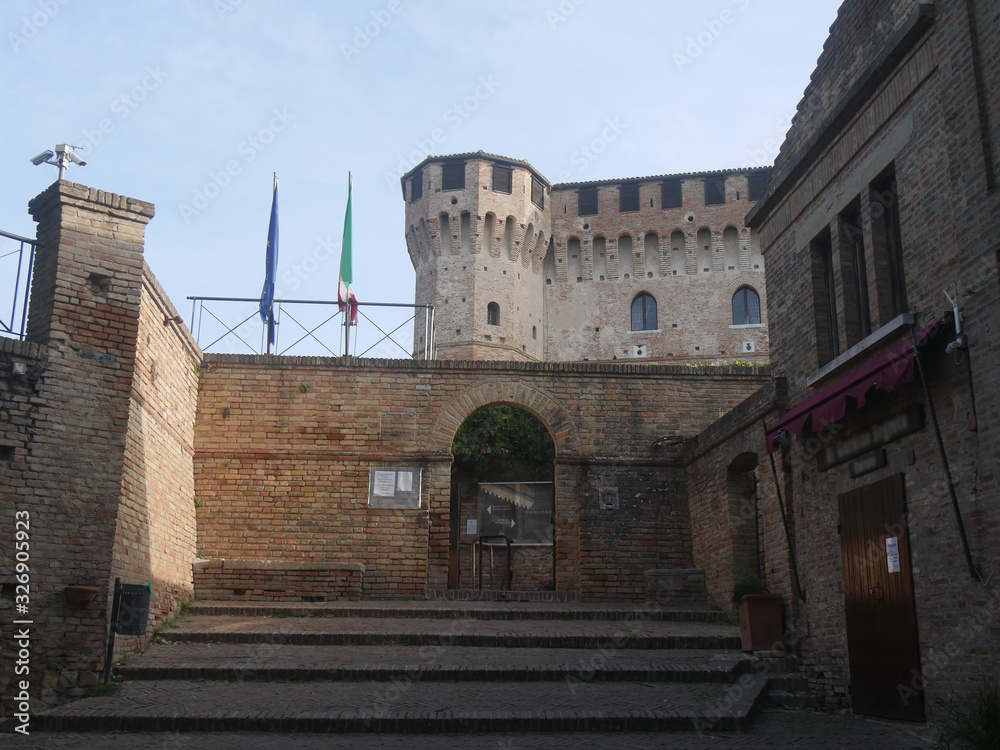 entrance of Gradara fortress and the facade of the church of San Giovanni Battista