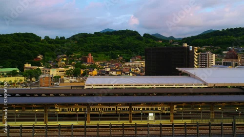 Kumamoto, Japan. Aerial view of a train station in a popular touristic city of Kyushu island Kumamoto, Japan in the morning. Time-lapse at sunrise, zoom in photo