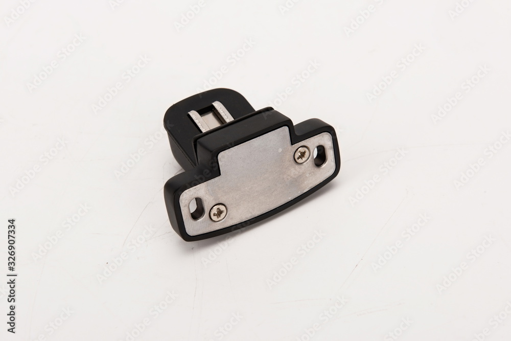 Various metal door stop tools on white background